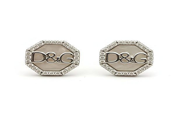 Pair of hexagonal earrings with 'D&G' logo on a white background