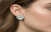 Close-up of a woman wearing a D&G earring with a blurred background