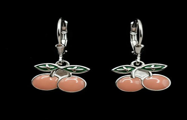Cherry-themed earrings on a black background