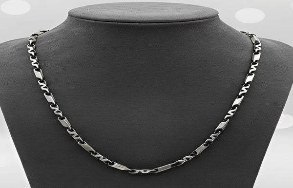 Silver chain necklace on a mannequin neck